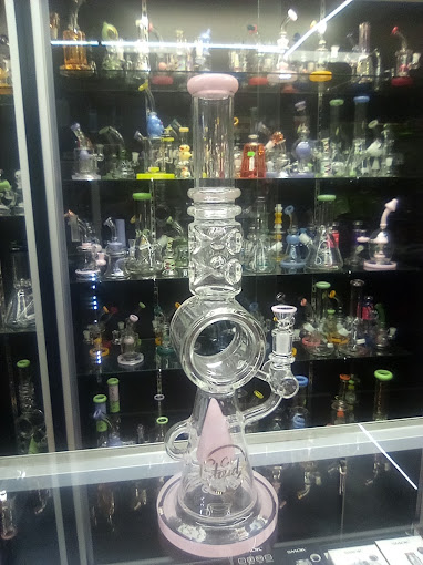 A glass bong sitting on top of a display case