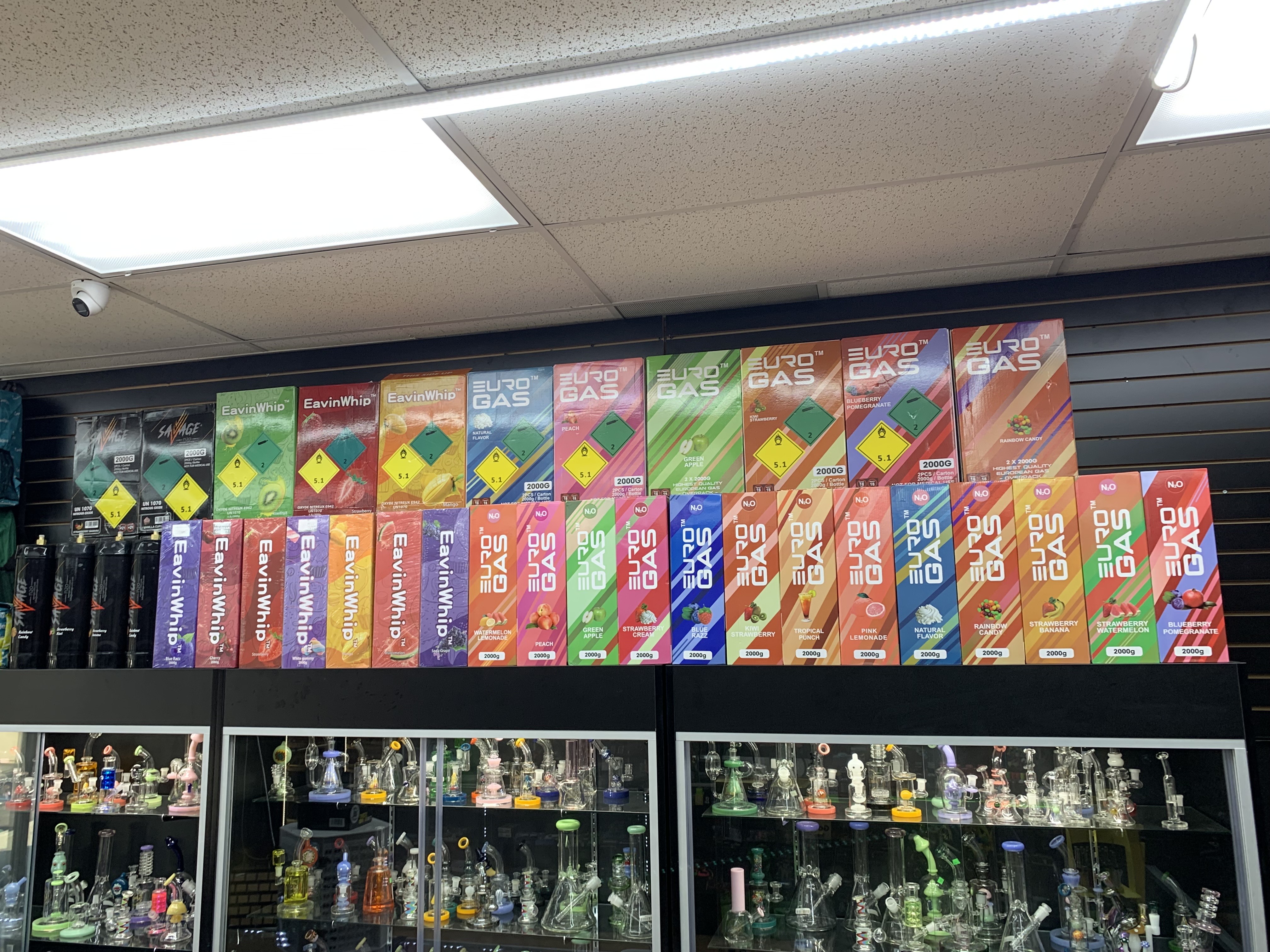 A display case in a store filled with lots of bottles